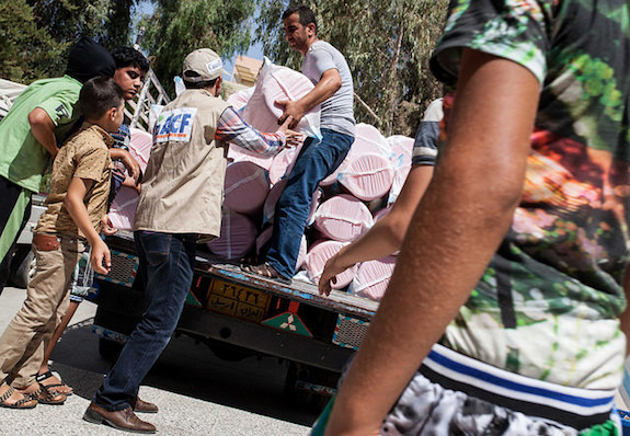 Action against hunger team deliver hygiene kits to iraqi refugees.by dfid